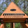 Canary wood, cedar top, with ebony trim